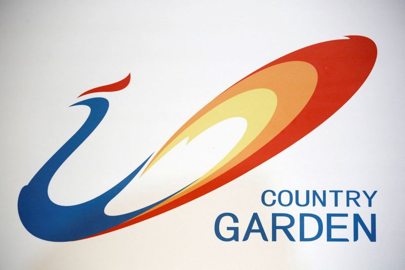 FILE PHOTO: The company logo of Chinese developer Country Garden is displayed at a news conference in Hong Kong